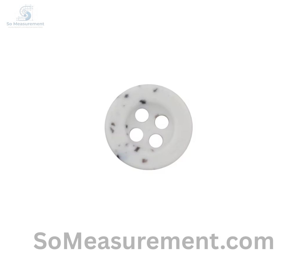 A Small Plastic Shirt Button that Weigh 1 Gram